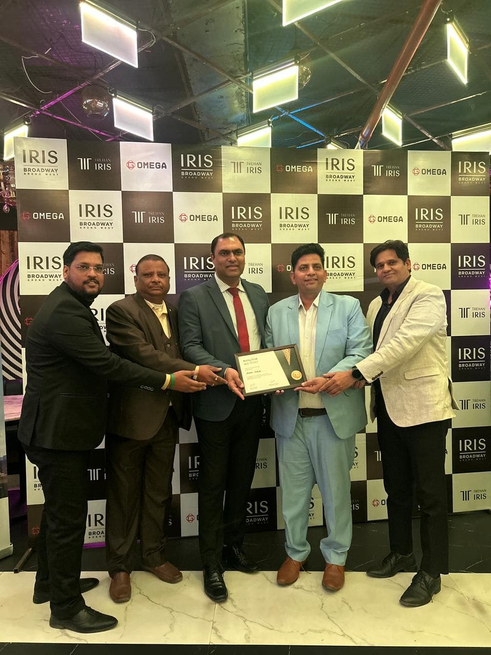 ANON INDIA receiving the Rising Star certificate on stage